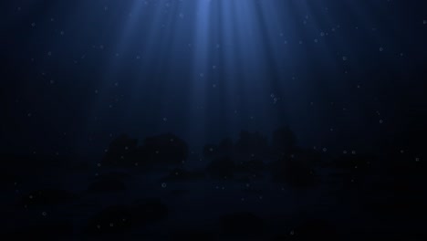 Dark-blue-ocean-bottom-with-bubbles-and-light-rays-deep-underwater